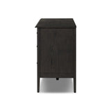 A cleanly shaped six-drawer dresser is crafted from smoked black oak, highlighting the wood's natural grain. Roomy drawers offer plenty of space for bedroom storage, while the slim, tapered legs give the piece a subtle lift, creating a grounded look Amethyst Home provides interior design, new home construction design consulting, vintage area rugs, and lighting in the Salt Lake City metro area.