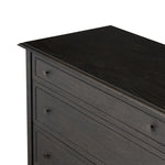 A cleanly shaped six-drawer dresser is crafted from smoked black oak, highlighting the wood's natural grain. Roomy drawers offer plenty of space for bedroom storage, while the slim, tapered legs give the piece a subtle lift, creating a grounded look Amethyst Home provides interior design, new home construction design consulting, vintage area rugs, and lighting in the Seattle metro area.