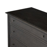 A cleanly shaped six-drawer dresser is crafted from smoked black oak, highlighting the wood's natural grain. Roomy drawers offer plenty of space for bedroom storage, while the slim, tapered legs give the piece a subtle lift, creating a grounded look Amethyst Home provides interior design, new home construction design consulting, vintage area rugs, and lighting in the Seattle metro area.