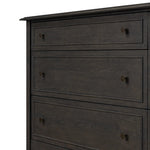 A cleanly shaped six-drawer dresser is crafted from smoked black oak, highlighting the wood's natural grain. Roomy drawers offer plenty of space for bedroom storage, while the slim, tapered legs give the piece a subtle lift, creating a grounded look Amethyst Home provides interior design, new home construction design consulting, vintage area rugs, and lighting in the Tampa metro area.