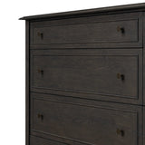 A cleanly shaped six-drawer dresser is crafted from smoked black oak, highlighting the wood's natural grain. Roomy drawers offer plenty of space for bedroom storage, while the slim, tapered legs give the piece a subtle lift, creating a grounded look Amethyst Home provides interior design, new home construction design consulting, vintage area rugs, and lighting in the Tampa metro area.
