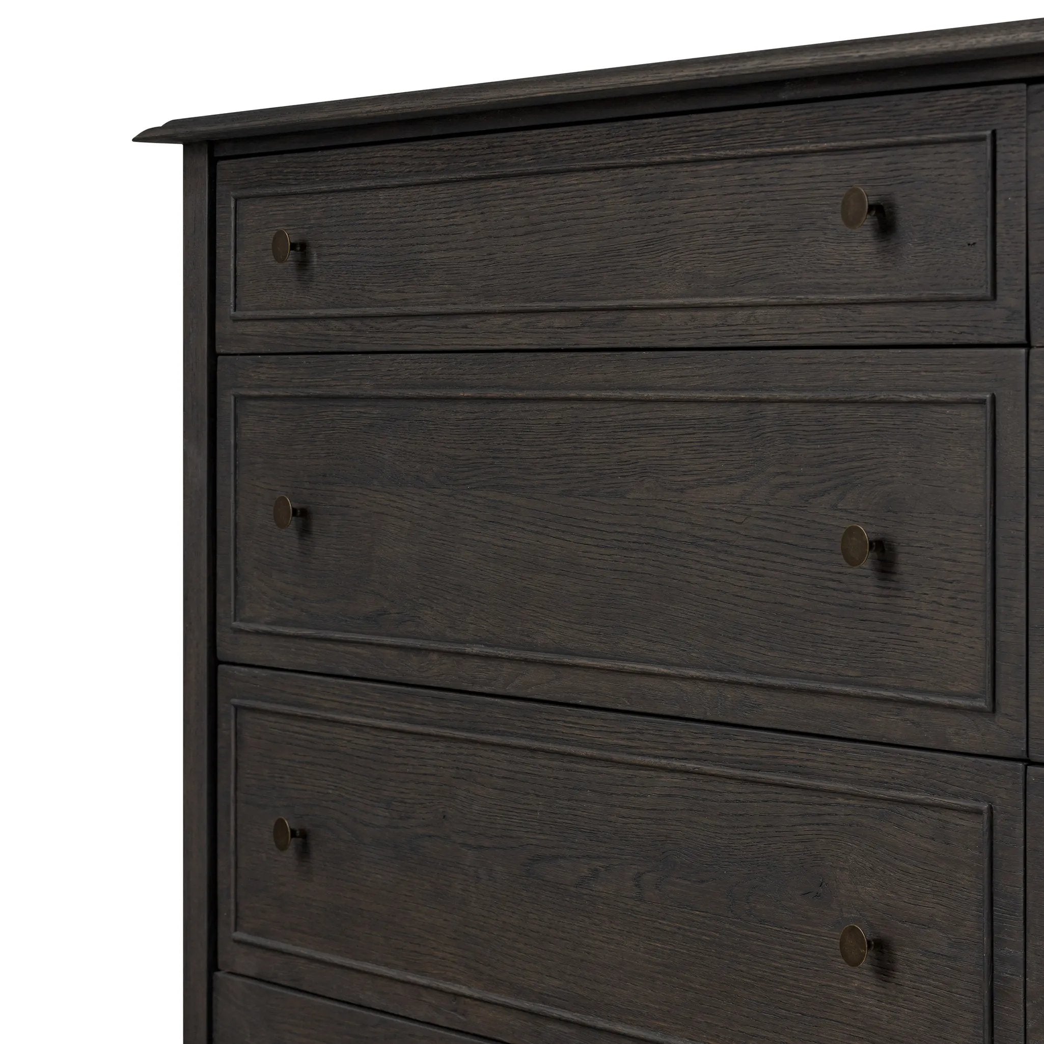 A cleanly shaped six-drawer dresser is crafted from smoked black oak, highlighting the wood's natural grain. Roomy drawers offer plenty of space for bedroom storage, while the slim, tapered legs give the piece a subtle lift, creating a grounded look Amethyst Home provides interior design, new home construction design consulting, vintage area rugs, and lighting in the Tampa metro area.