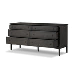 A cleanly shaped six-drawer dresser is crafted from smoked black oak, highlighting the wood's natural grain. Roomy drawers offer plenty of space for bedroom storage, while the slim, tapered legs give the piece a subtle lift, creating a grounded look Amethyst Home provides interior design, new home construction design consulting, vintage area rugs, and lighting in the Winter Garden metro area.
