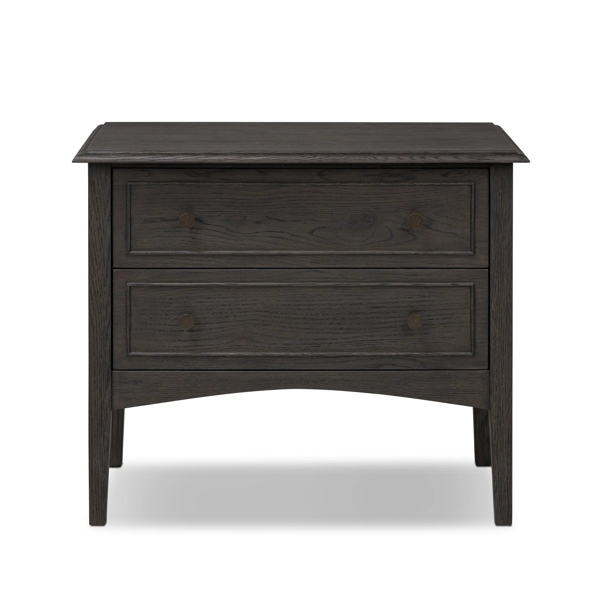 Clean and compact, a two-drawer nightstand is crafted from smoked black oak, showcasing the natural grain of wood. Its scaled-down profile fits perfectly beside the bed. Slim, tapered legs add a touch of lightness Amethyst Home provides interior design, new home construction design consulting, vintage area rugs, and lighting in the Kansas City metro area.