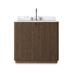 This bath vanity is simply shaped to allow the reeded oak to shine. Rounded corners bring softness and allow for a seamless finish, complemented by tapered knob hardware. Finished with a bath-safe sealant for moisture resistance. Designed to accommodate 8”-widespread faucets and standard-size hardware for easy customization. Amethyst Home provides interior design, new home construction design consulting, vintage area rugs, and lighting in the Boston metro area.