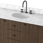 This bath vanity is simply shaped to allow the reeded oak to shine. Rounded corners bring softness and allow for a seamless finish, complemented by tapered knob hardware. Finished with a bath-safe sealant for moisture resistance. Designed to accommodate 8”-widespread faucets and standard-size hardware for easy customization. Amethyst Home provides interior design, new home construction design consulting, vintage area rugs, and lighting in the Kansas City metro area.