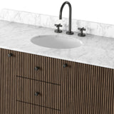 This bath vanity is simply shaped to allow the reeded oak to shine. Rounded corners bring softness and allow for a seamless finish, complemented by tapered knob hardware. Finished with a bath-safe sealant for moisture resistance. Designed to accommodate 8”-widespread faucets and standard-size hardware for easy customization. Amethyst Home provides interior design, new home construction design consulting, vintage area rugs, and lighting in the Kansas City metro area.