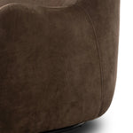 Modern wingback with a twist of barrel back design, this enveloping swivel chair comes with velvety upholstery in a deep brown hue. Deeply cushioned back and seating for maximum comfort, the chair is affixed to a 360-degree swivel base for relaxed lounging Amethyst Home provides interior design, new home construction design consulting, vintage area rugs, and lighting in the Austin metro area.