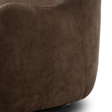 Modern wingback with a twist of barrel back design, this enveloping swivel chair comes with velvety upholstery in a deep brown hue. Deeply cushioned back and seating for maximum comfort, the chair is affixed to a 360-degree swivel base for relaxed lounging Amethyst Home provides interior design, new home construction design consulting, vintage area rugs, and lighting in the Austin metro area.