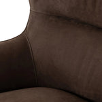 Modern wingback with a twist of barrel back design, this enveloping swivel chair comes with velvety upholstery in a deep brown hue. Deeply cushioned back and seating for maximum comfort, the chair is affixed to a 360-degree swivel base for relaxed lounging Amethyst Home provides interior design, new home construction design consulting, vintage area rugs, and lighting in the Calabasas metro area.
