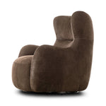 Modern wingback with a twist of barrel back design, this enveloping swivel chair comes with velvety upholstery in a deep brown hue. Deeply cushioned back and seating for maximum comfort, the chair is affixed to a 360-degree swivel base for relaxed lounging Amethyst Home provides interior design, new home construction design consulting, vintage area rugs, and lighting in the Monterey metro area.