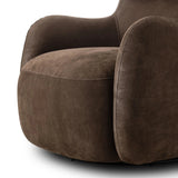 Modern wingback with a twist of barrel back design, this enveloping swivel chair comes with velvety upholstery in a deep brown hue. Deeply cushioned back and seating for maximum comfort, the chair is affixed to a 360-degree swivel base for relaxed lounging Amethyst Home provides interior design, new home construction design consulting, vintage area rugs, and lighting in the Scottsdale metro area.