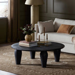 Featuring Maricopa Dark Totem Large Coffee Table by Four Hands at Amethyst Home. Play up proportions. Large, shapely, legs support a rounded tabletop of light black-finished solid reclaimed woods, for a global, organic look and handcrafted feel. Overall Dimensions: 50.00"w x 50.00"d x 16.00"h. Amethyst Home provides interior design, new home construction design consulting, vintage area rugs, and lighting in the Calabasas metro area.