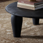Featuring Maricopa Dark Totem Large Coffee Table by Four Hands at Amethyst Home. Play up proportions. Large, shapely, legs support a rounded tabletop of light black-finished solid reclaimed woods, for a global, organic look and handcrafted feel. Overall Dimensions: 50.00"w x 50.00"d x 16.00"h. Amethyst Home provides interior design, new home construction design consulting, vintage area rugs, and lighting in the Dallas metro area.