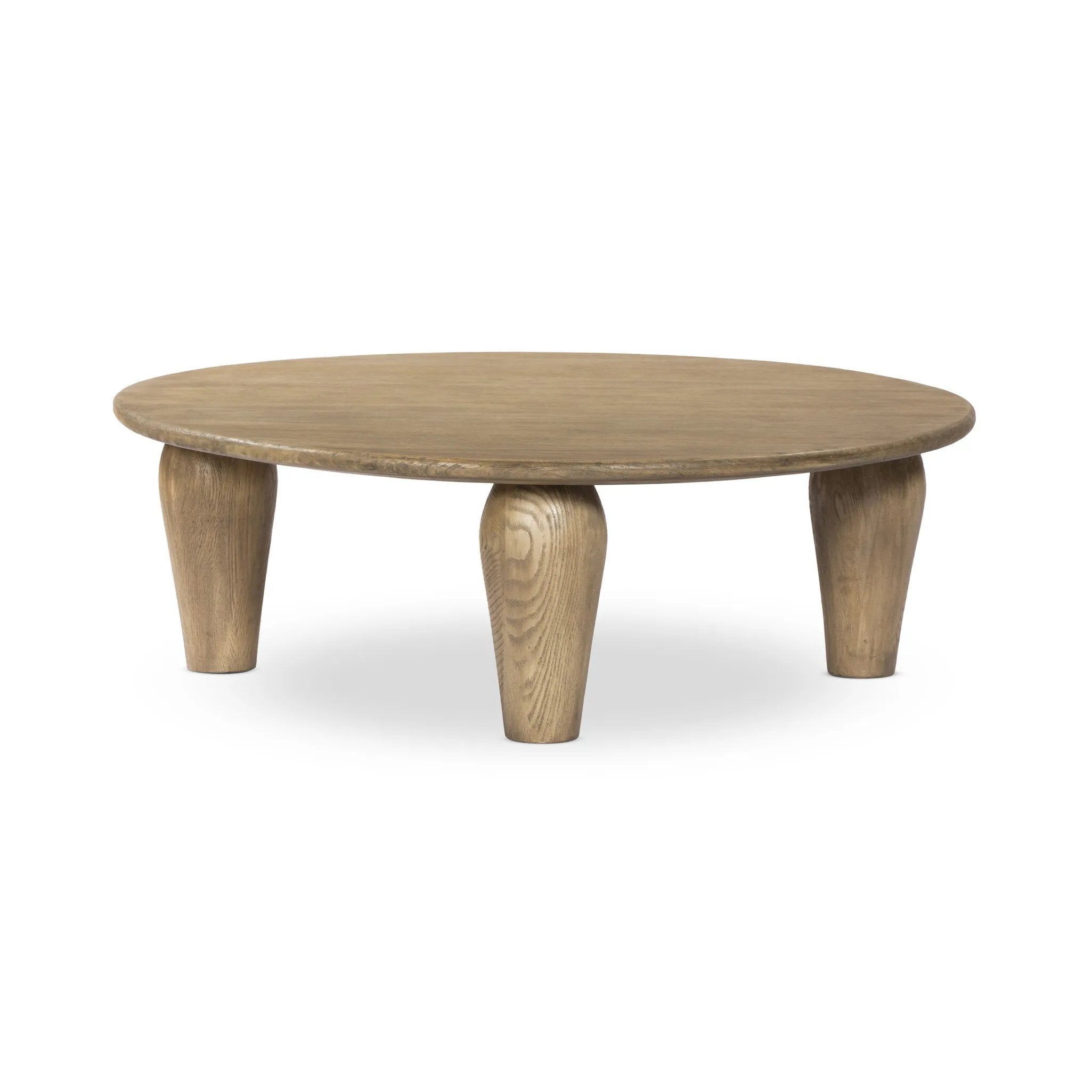 Play up proportions. Large, shapely legs support a rounded tabletop of worn oak, for a global, organic look and handcrafted feel Amethyst Home provides interior design, new home construction design consulting, vintage area rugs, and lighting in the Park City metro area.