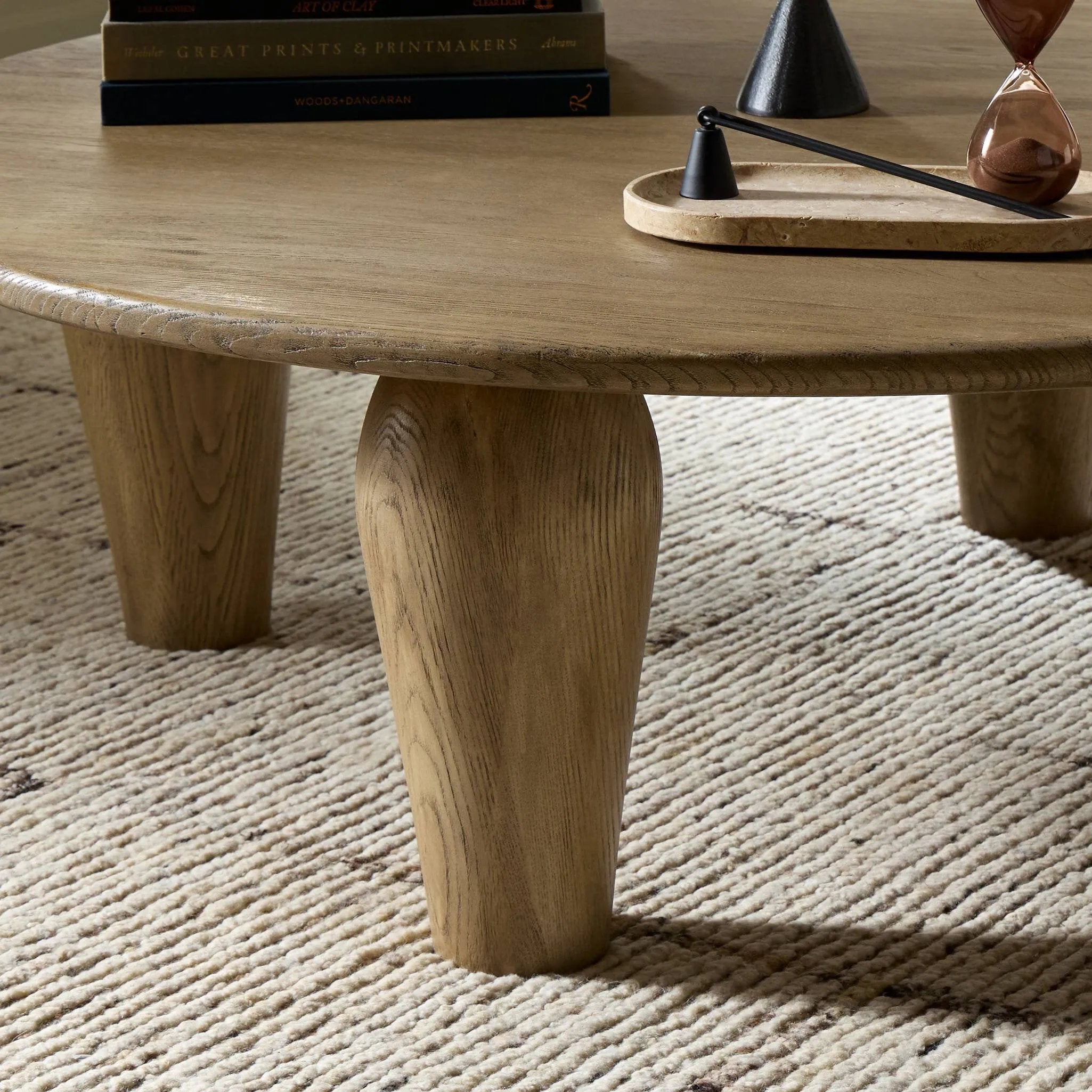 Play up proportions. Large, shapely legs support a rounded tabletop of worn oak, for a global, organic look and handcrafted feel Amethyst Home provides interior design, new home construction design consulting, vintage area rugs, and lighting in the Winter Garden metro area.