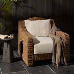 Twisted faux rattan is double twisted for a chunky feel, inspired by traditional coastal designs. The fully woven, cambelback silhouette of this outdoor chair adds visual interest, with high-end, linen-like upholstery bringing subtle contrast to the seat cushions. Amethyst Home provides interior design, new home construction design consulting, vintage area rugs, and lighting in the Boston metro area.