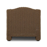 Twisted faux rattan is double twisted for a chunky feel, inspired by traditional coastal designs. The fully woven, cambelback silhouette of this outdoor chair adds visual interest, with high-end, linen-like upholstery bringing subtle contrast to the seat cushions. Amethyst Home provides interior design, new home construction design consulting, vintage area rugs, and lighting in the Houston metro area.