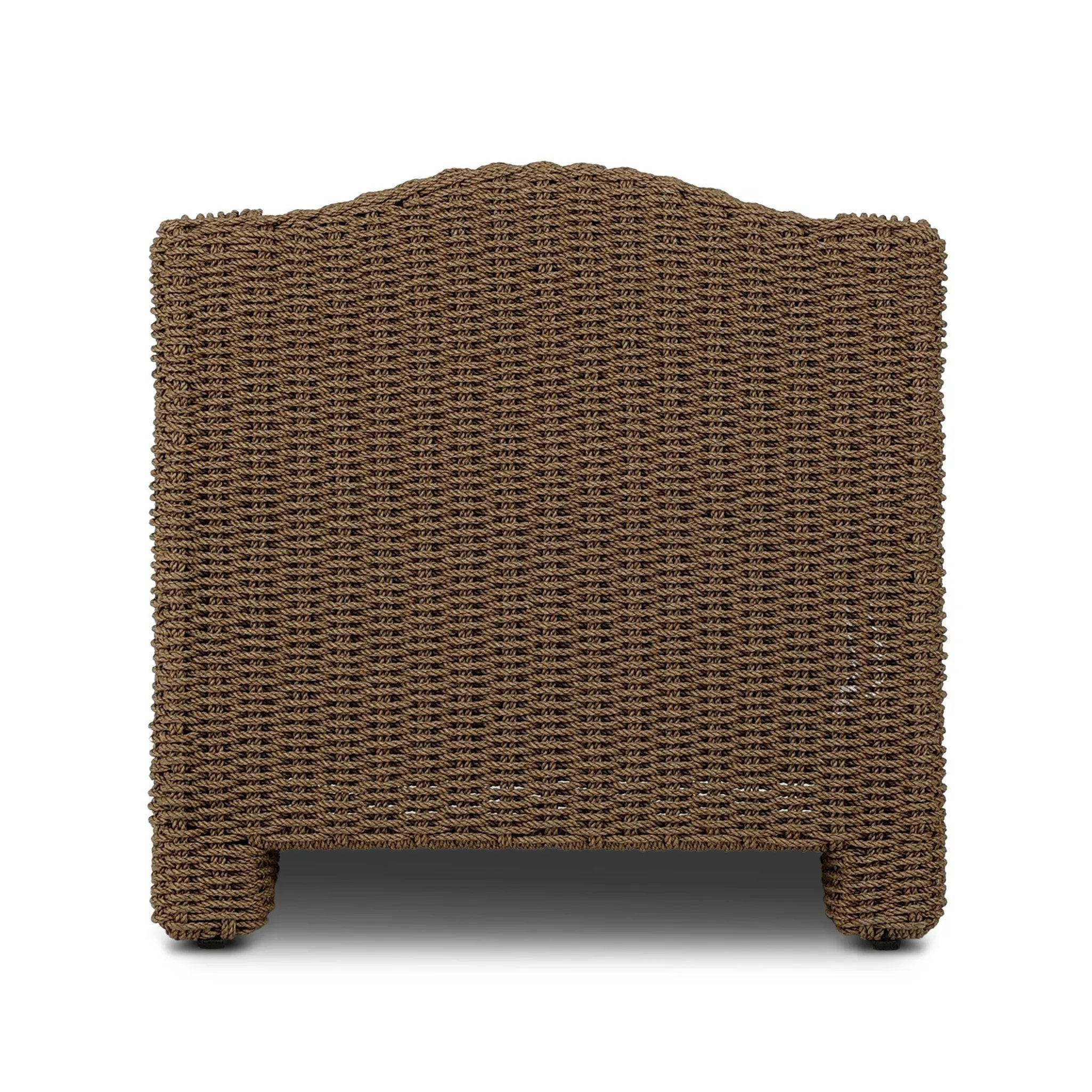 Twisted faux rattan is double twisted for a chunky feel, inspired by traditional coastal designs. The fully woven, cambelback silhouette of this outdoor chair adds visual interest, with high-end, linen-like upholstery bringing subtle contrast to the seat cushions. Amethyst Home provides interior design, new home construction design consulting, vintage area rugs, and lighting in the Houston metro area.