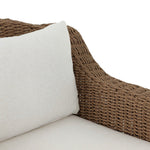 Twisted faux rattan is double twisted for a chunky feel, inspired by traditional coastal designs. The fully woven, cambelback silhouette of this outdoor chair adds visual interest, with high-end, linen-like upholstery bringing subtle contrast to the seat cushions. Amethyst Home provides interior design, new home construction design consulting, vintage area rugs, and lighting in the Miami metro area.