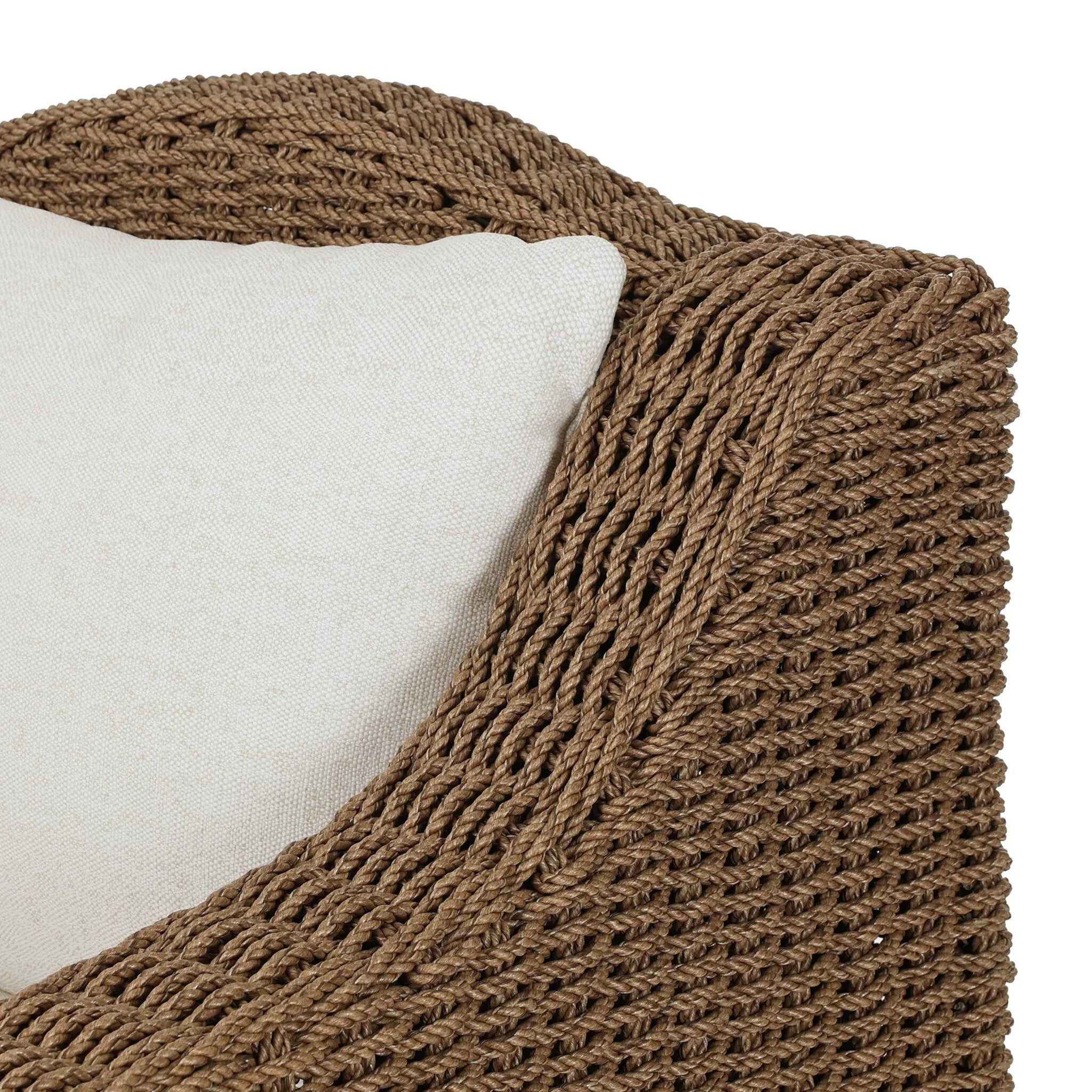 Twisted faux rattan is double twisted for a chunky feel, inspired by traditional coastal designs. The fully woven, cambelback silhouette of this outdoor chair adds visual interest, with high-end, linen-like upholstery bringing subtle contrast to the seat cushions. Amethyst Home provides interior design, new home construction design consulting, vintage area rugs, and lighting in the Nashville metro area.