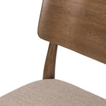 An armless dining style pairs a slim profile and curved back, for a beautifully contoured look. Framed by tan-finished solid oak featuring a center cutout, a seat cushion upholstered in high-performance fabric crafts a comfortable seat perfect for everyday dining. Amethyst Home provides interior design, new home construction design consulting, vintage area rugs, and lighting in the San Diego metro area.