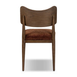 An armless dining style pairs a slim profile and curved back, for a beautifully contoured look. Framed by dark-finished solid oak featuring a center cutout, velvety, rust-colored cushioning crafts a comfortable seat perfect for everyday dining Amethyst Home provides interior design, new home construction design consulting, vintage area rugs, and lighting in the Omaha metro area.