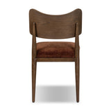 An armless dining style pairs a slim profile and curved back, for a beautifully contoured look. Framed by dark-finished solid oak featuring a center cutout, velvety, rust-colored cushioning crafts a comfortable seat perfect for everyday dining Amethyst Home provides interior design, new home construction design consulting, vintage area rugs, and lighting in the Omaha metro area.
