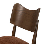 An armless dining style pairs a slim profile and curved back, for a beautifully contoured look. Framed by dark-finished solid oak featuring a center cutout, velvety, rust-colored cushioning crafts a comfortable seat perfect for everyday dining Amethyst Home provides interior design, new home construction design consulting, vintage area rugs, and lighting in the Park City metro area.