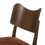 An armless dining style pairs a slim profile and curved back, for a beautifully contoured look. Framed by dark-finished solid oak featuring a center cutout, velvety, rust-colored cushioning crafts a comfortable seat perfect for everyday dining Amethyst Home provides interior design, new home construction design consulting, vintage area rugs, and lighting in the Park City metro area.