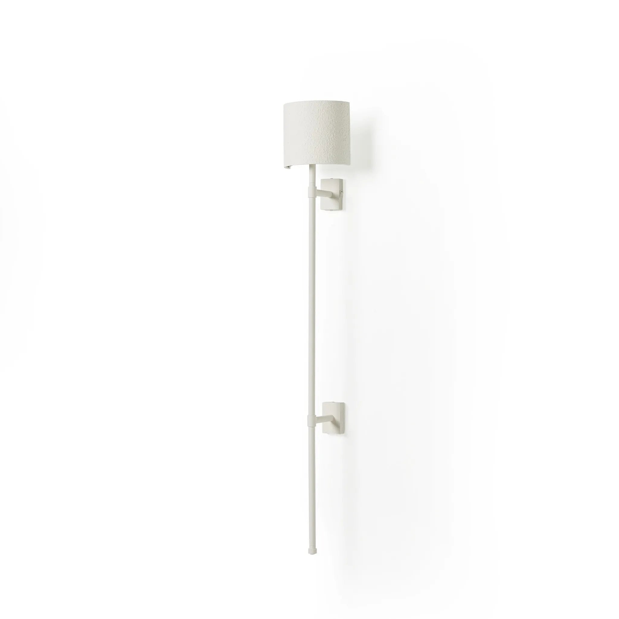 Housed behind a curved black shade, light beams with a soft glow both upward and downward from this plug-in sconce.  A  slim pole to hide the cord and a convenient switch on the backplate create a seamless look Amethyst Home provides interior design, new home construction design consulting, vintage area rugs, and lighting in the Park City metro area.