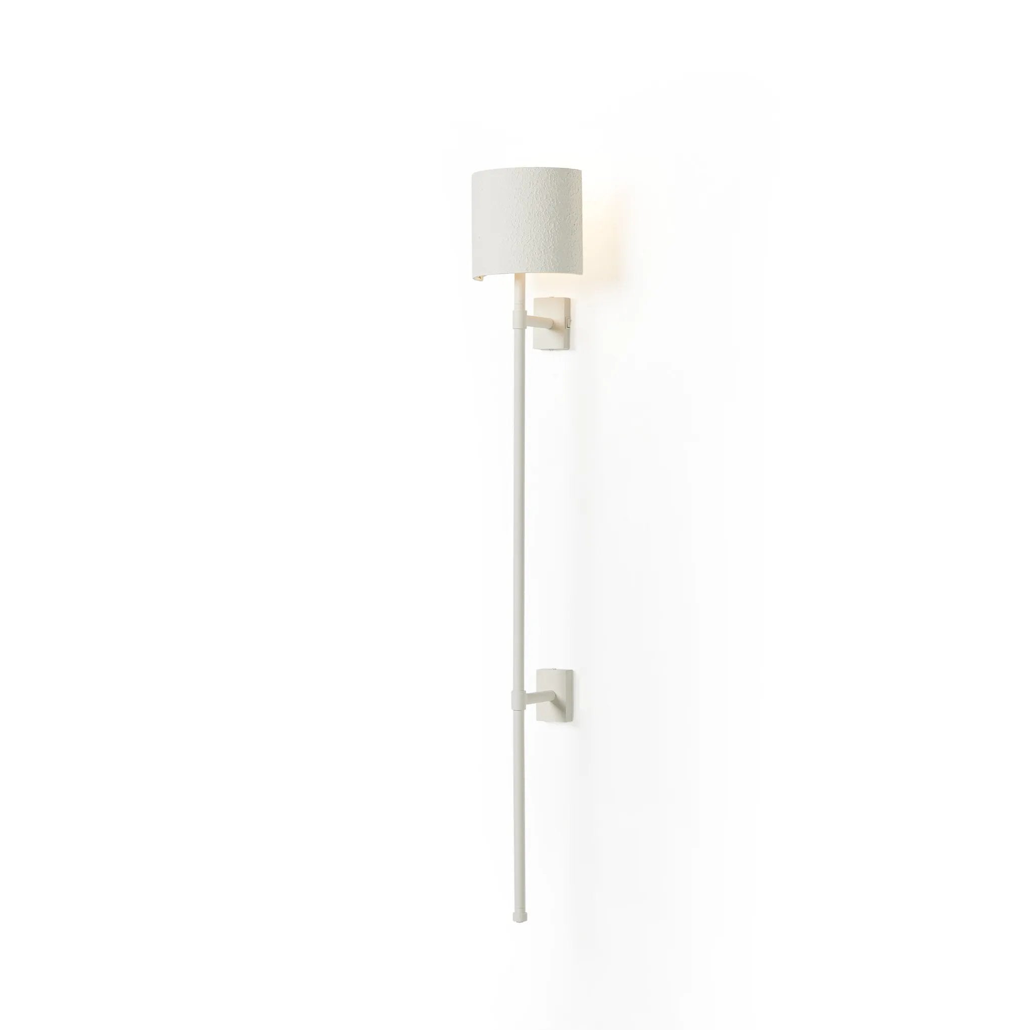 Housed behind a curved black shade, light beams with a soft glow both upward and downward from this plug-in sconce.  A  slim pole to hide the cord and a convenient switch on the backplate create a seamless look Amethyst Home provides interior design, new home construction design consulting, vintage area rugs, and lighting in the Salt Lake City metro area.