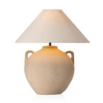 Featuring Mays Light Sand Porcelain Table Lamp by Four Hands at Amethyst Home. Inspired by vintage clay jars, a light sand-colored talavera lamp with handle-like detailing pairs with a tapered linen shade in a versatile ivory. Overall Dimensions: 22.00"w x 22.00"d x 21.00"h
 Shop this lamp at Amethyst - https://www.amethysthome.com/products/mays-light-sand-. Amethyst Home provides interior design, new home construction design consulting, vintage area rugs, and lighting in the Nashville metro area.