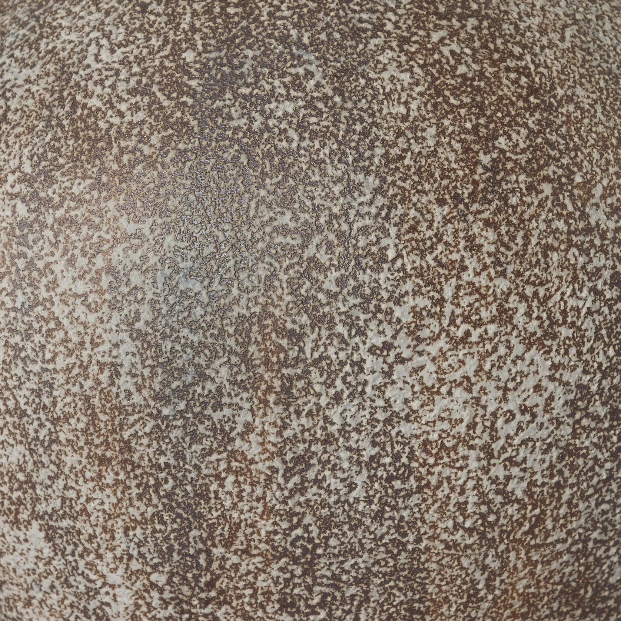 Inspired by vintage clay jars, a brown talavera lamp with handle-like detailing pairs with a tapered linen shade in a versatile ivory Amethyst Home provides interior design, new home construction design consulting, vintage area rugs, and lighting in the Charlotte metro area.