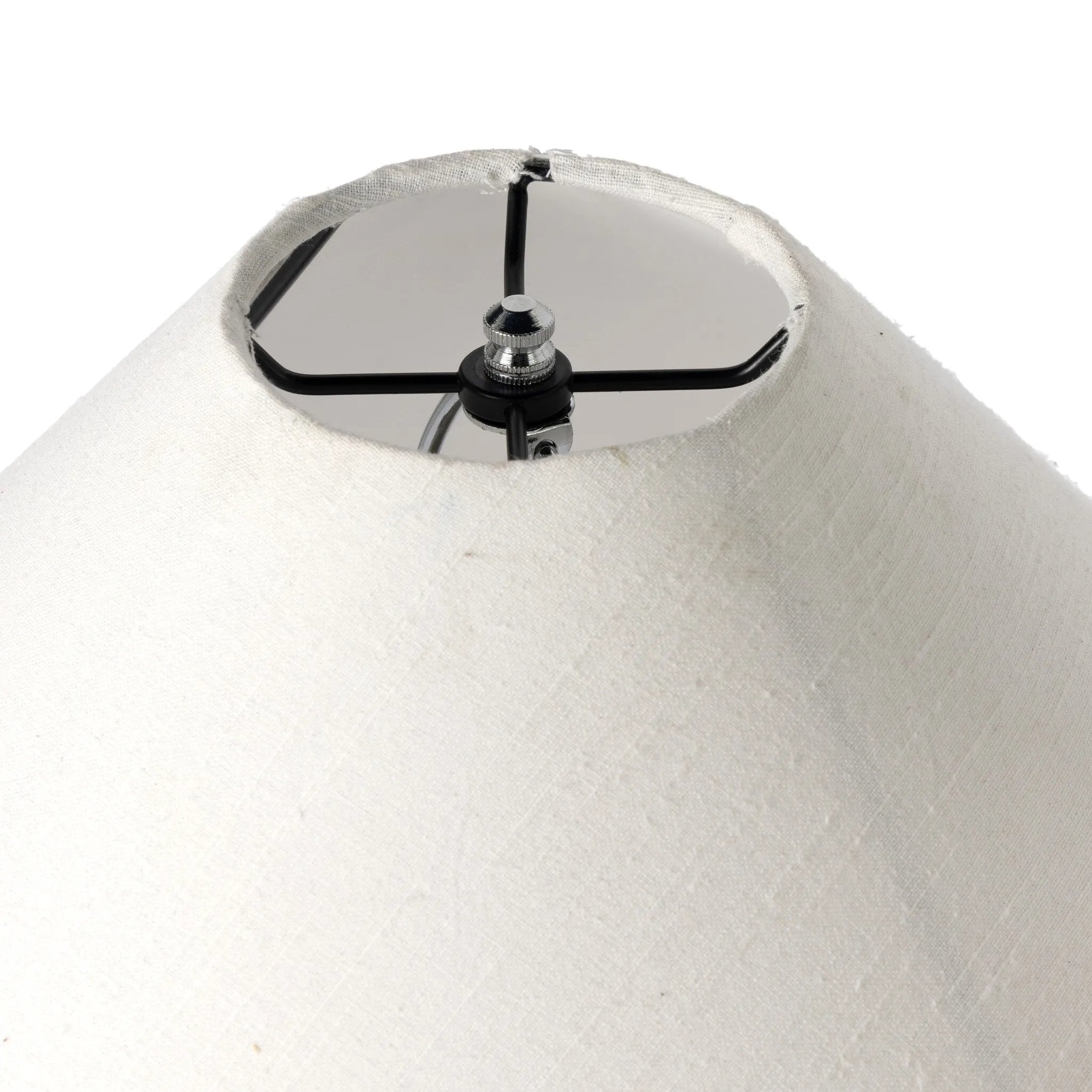 Inspired by vintage clay jars, a brown talavera lamp with handle-like detailing pairs with a tapered linen shade in a versatile ivory Amethyst Home provides interior design, new home construction design consulting, vintage area rugs, and lighting in the Kansas City metro area.