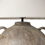 Inspired by vintage clay jars, a brown talavera lamp with handle-like detailing pairs with a tapered linen shade in a versatile ivory Amethyst Home provides interior design, new home construction design consulting, vintage area rugs, and lighting in the Seattle metro area.