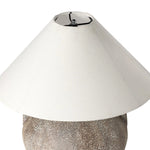 Inspired by vintage clay jars, a brown talavera lamp with handle-like detailing pairs with a tapered linen shade in a versatile ivory Amethyst Home provides interior design, new home construction design consulting, vintage area rugs, and lighting in the Winter Garden metro area.