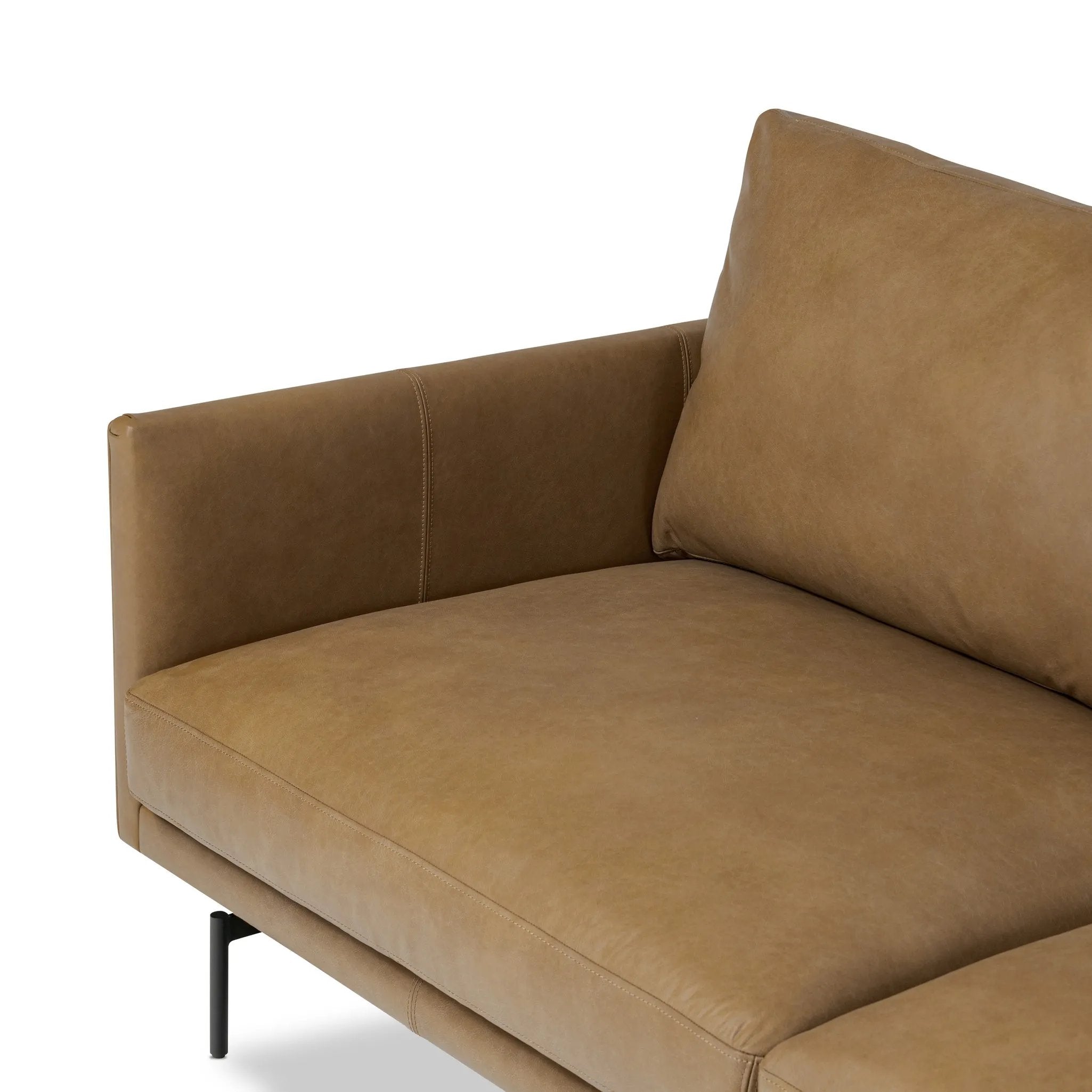 A minimalist sectional to redefine contemporary lounging. Made from tan top-grain leather with a slim profile, expert tailoring and plush cushions for comfort. Sleek metal legs and compact sizing make this piece a versatile anchor for smaller living spaces Amethyst Home provides interior design, new home construction design consulting, vintage area rugs, and lighting in the Alpharetta metro area.