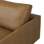 A minimalist sectional to redefine contemporary lounging. Made from tan top-grain leather with a slim profile, expert tailoring and plush cushions for comfort. Sleek metal legs and compact sizing make this piece a versatile anchor for smaller living spaces Amethyst Home provides interior design, new home construction design consulting, vintage area rugs, and lighting in the Boston metro area.