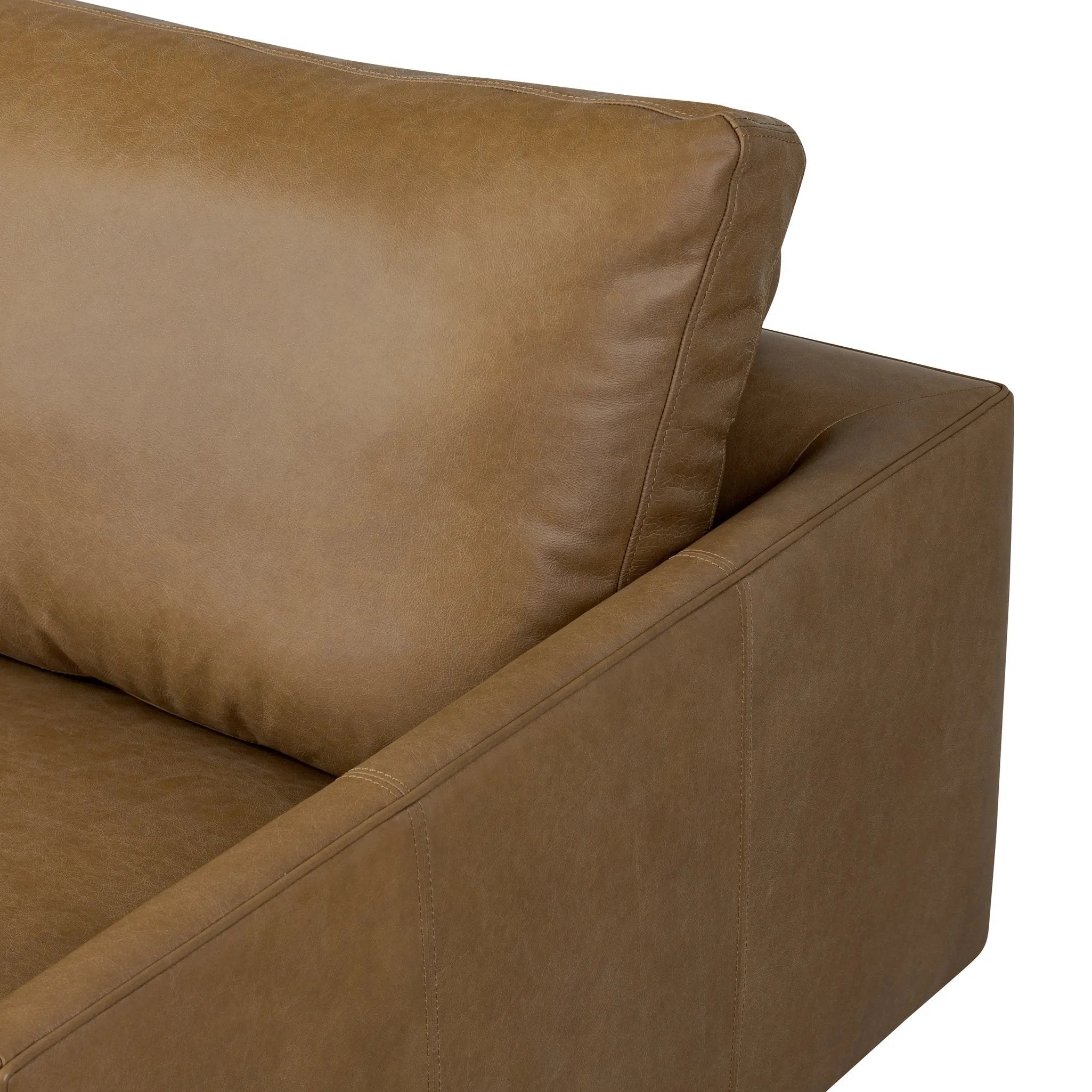 A minimalist sectional to redefine contemporary lounging. Made from tan top-grain leather with a slim profile, expert tailoring and plush cushions for comfort. Sleek metal legs and compact sizing make this piece a versatile anchor for smaller living spaces Amethyst Home provides interior design, new home construction design consulting, vintage area rugs, and lighting in the Boston metro area.