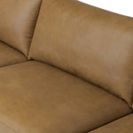 A minimalist sectional to redefine contemporary lounging. Made from tan top-grain leather with a slim profile, expert tailoring and plush cushions for comfort. Sleek metal legs and compact sizing make this piece a versatile anchor for smaller living spaces Amethyst Home provides interior design, new home construction design consulting, vintage area rugs, and lighting in the Dallas metro area.