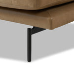 A minimalist sectional to redefine contemporary lounging. Made from tan top-grain leather with a slim profile, expert tailoring and plush cushions for comfort. Sleek metal legs and compact sizing make this piece a versatile anchor for smaller living spaces Amethyst Home provides interior design, new home construction design consulting, vintage area rugs, and lighting in the Scottsdale metro area.