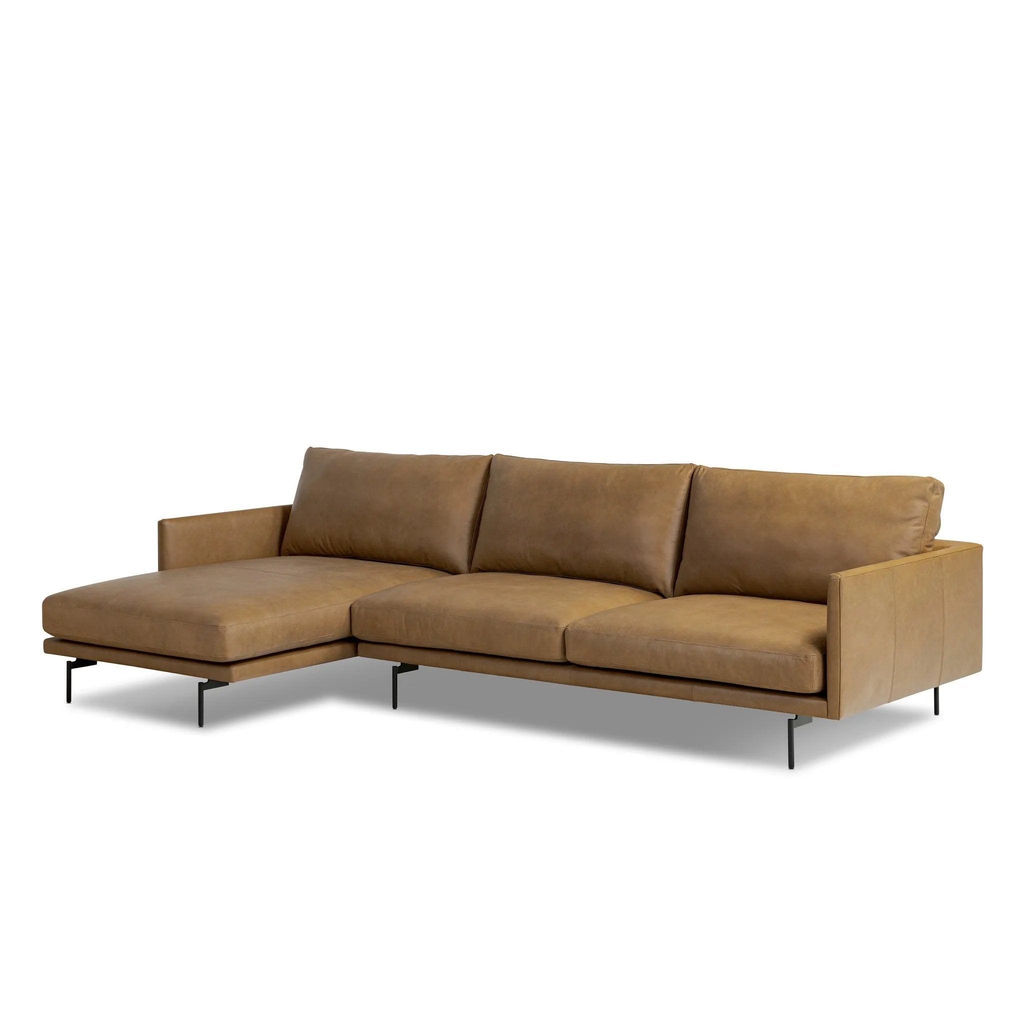 A minimalist sectional to redefine contemporary lounging. Made from tan top-grain leather with a slim profile, expert tailoring and plush cushions for comfort. Sleek metal legs and compact sizing make this piece a versatile anchor for smaller living spaces Amethyst Home provides interior design, new home construction design consulting, vintage area rugs, and lighting in the Seattle metro area.