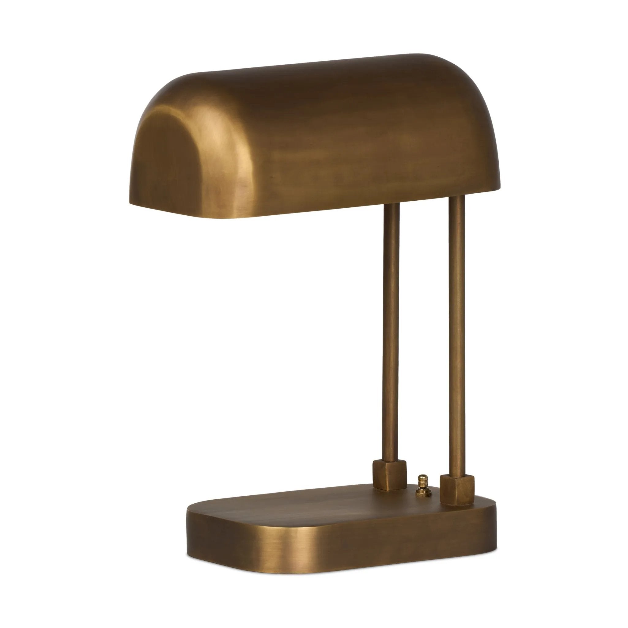A library task light brings focused illumination to your workspace, nightstand or end table. Crafted from brass with an aged antique finish, the lamp has a rotary switch on the base and double post arms to hold the metal shade in place Amethyst Home provides interior design, new home construction design consulting, vintage area rugs, and lighting in the Boston metro area.