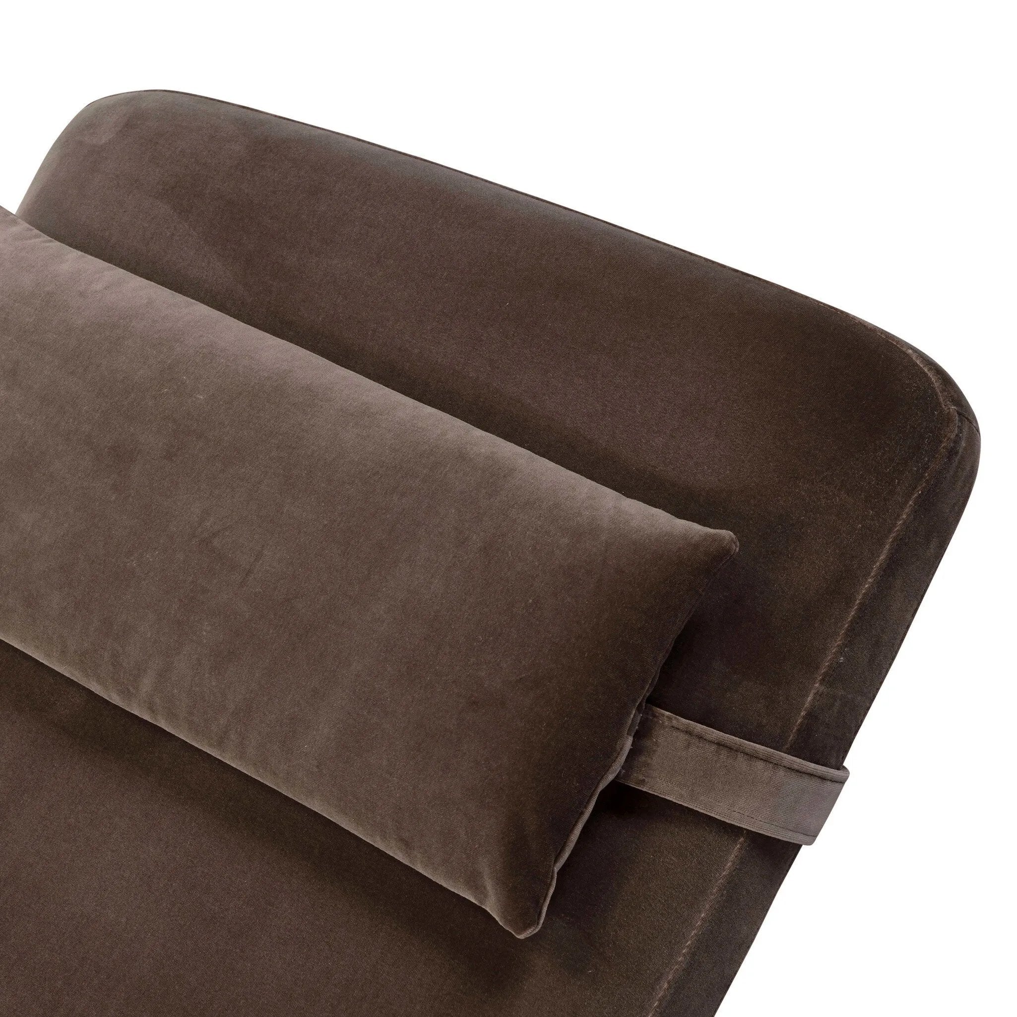 Contoured for comfort, this minimalist chaise is fixed with ideal ergonomics so you can simply sit back and unwind. Inspired by 1960s European design, the chaise blends a utilitarian aesthetic with high-quality tufting, stainless-steel framing, and smooth upholstery. The adjustable headrest is secured by a metal closure and magnetic strip. Amethyst Home provides interior design, new home construction design consulting, vintage area rugs, and lighting in the Winter Garden metro area.