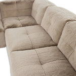 Modularity at its best, and softest. This versatile sectional includes seven pieces crafted with soft cushioning and S-spring suspension for a supportive sit. All covered in a plush, furry fabric that feels luxurious to sink into. Discreet seams add a touch of structure throughout Amethyst Home provides interior design, new home construction design consulting, vintage area rugs, and lighting in the Houston metro area.