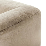 Modularity at its best, and softest. This versatile sectional includes seven pieces crafted with soft cushioning and S-spring suspension for a supportive sit. All covered in a plush, furry fabric that feels luxurious to sink into. Discreet seams add a touch of structure throughout Amethyst Home provides interior design, new home construction design consulting, vintage area rugs, and lighting in the Nashville metro area.