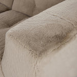 Modularity at its best, and softest. This versatile sectional includes seven pieces crafted with soft cushioning and S-spring suspension for a supportive sit. All covered in a plush, furry fabric that feels luxurious to sink into. Discreet seams add a touch of structure throughout Amethyst Home provides interior design, new home construction design consulting, vintage area rugs, and lighting in the San Diego metro area.