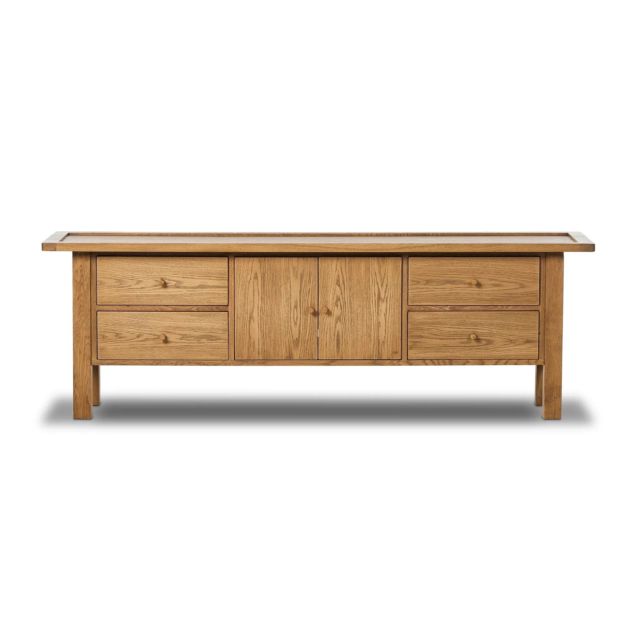 Inspired by a vintage general store counter, this console table features a heritage design with a modern twist. Thick oak legs with softened corners provide sturdy support, while oak knobs add a touch of classic charm. The inset tray top and varied drawer configuration offer ample storage Amethyst Home provides interior design, new home construction design consulting, vintage area rugs, and lighting in the Dallas metro area.