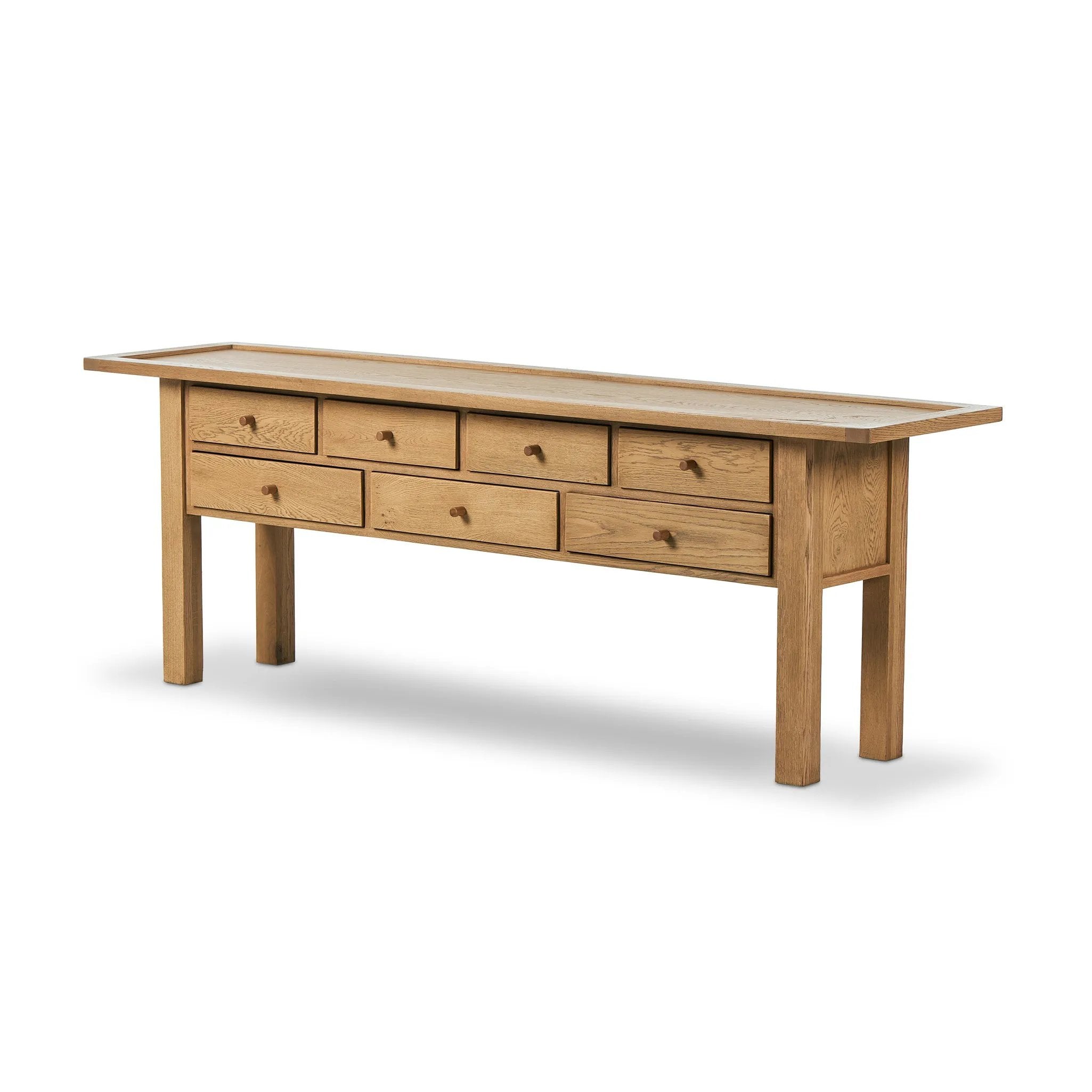 Inspired by a vintage general store counter, this console table features a heritage design with a modern twist. Thick oak legs with softened corners provide sturdy support, while oak knobs add a touch of classic charm. The inset tray top and varied drawer configuration offer ample storage Amethyst Home provides interior design, new home construction design consulting, vintage area rugs, and lighting in the Newport Beach metro area.
